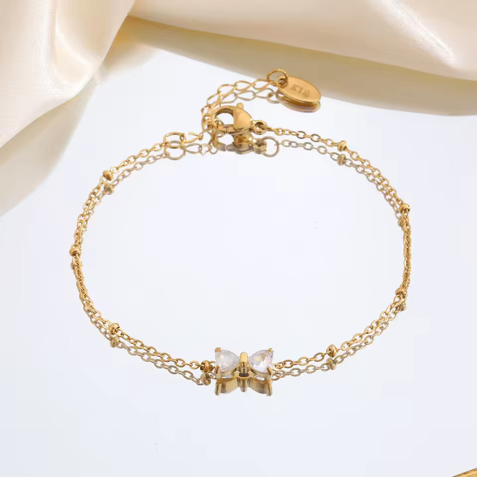 🎀 Zirkon-Schleifenarmband – Goldfarben, Edelstahl & Perlenkette🎀