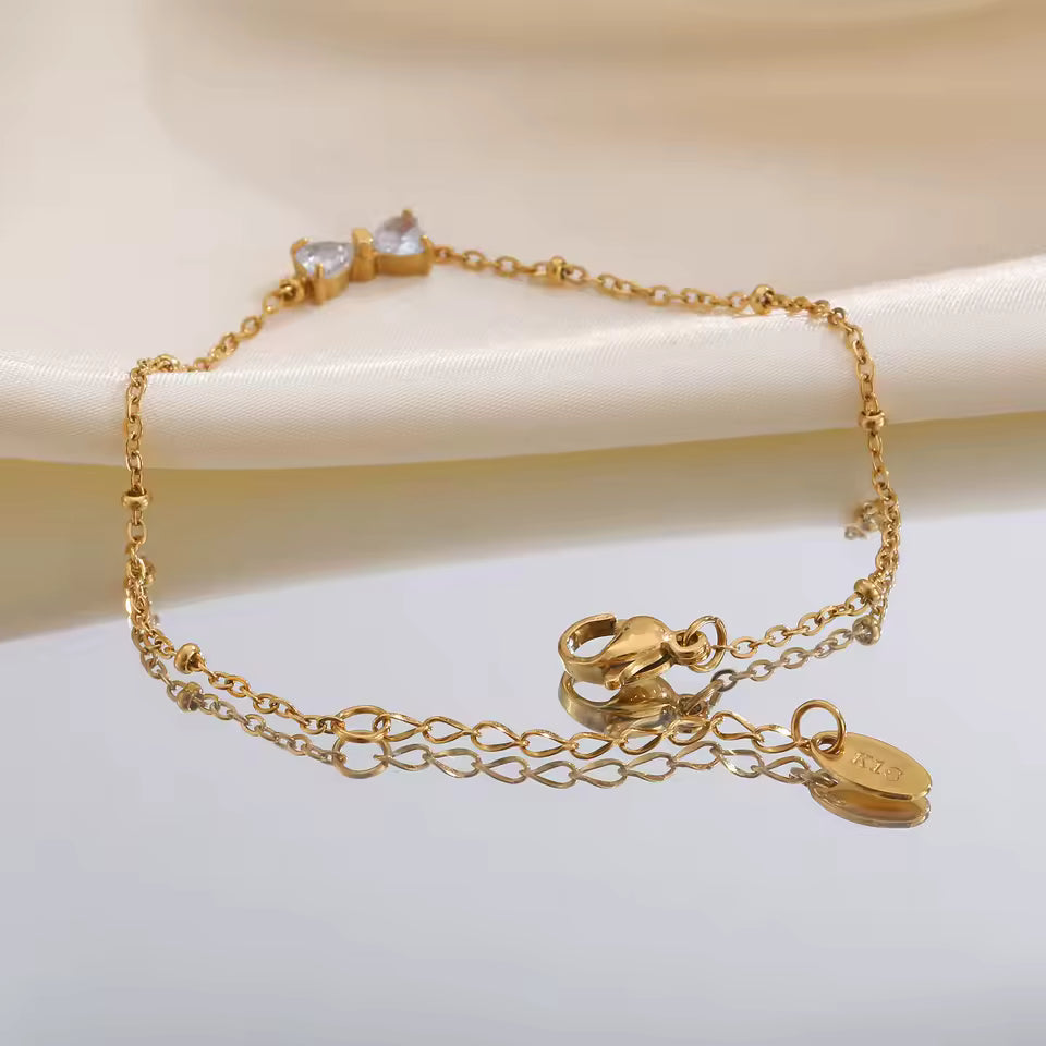 🎀 Zirkon-Schleifenarmband – Goldfarben, Edelstahl & Perlenkette🎀